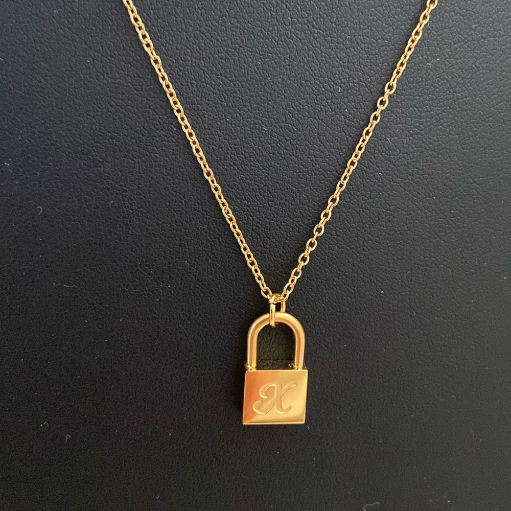 “X” initial lock charm necklace.  NWOT